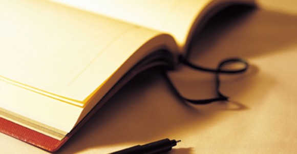 open book with pen open book with pen